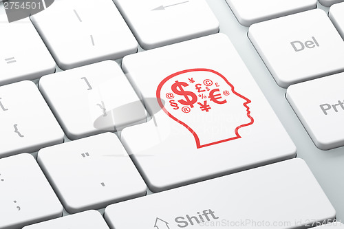 Image of Finance concept: Head With Finance Symbol on computer keyboard b