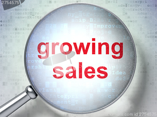 Image of Finance concept: Growing Sales with optical glass