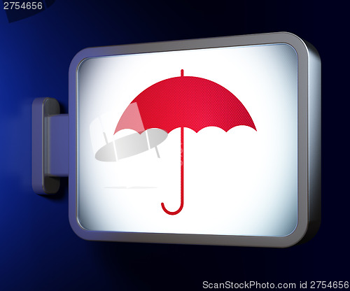 Image of Protection concept: Umbrella on billboard background