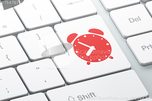 Image of Time concept: Alarm Clock on computer keyboard background