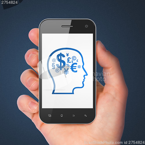 Image of Education concept: Head With Finance Symbol on smartphone