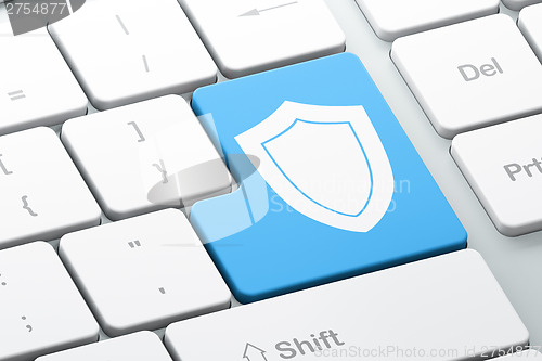 Image of Privacy concept: Shield on computer keyboard background