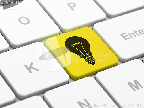 Image of Business concept: Light Bulb on computer keyboard background