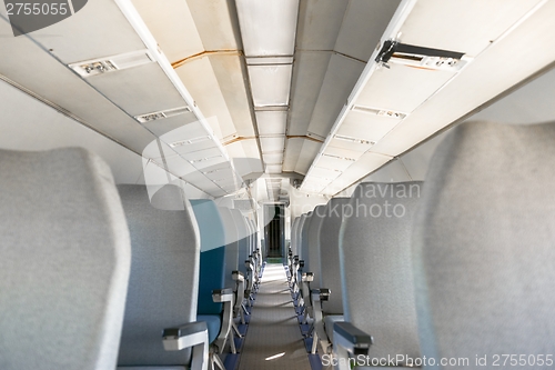 Image of Interior of an airplane with many seats