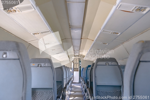 Image of Interior of an airplane with many seats