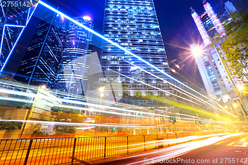 Image of Fast moving car light in city 