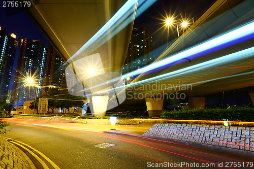 Image of Fast moving car light in city at night