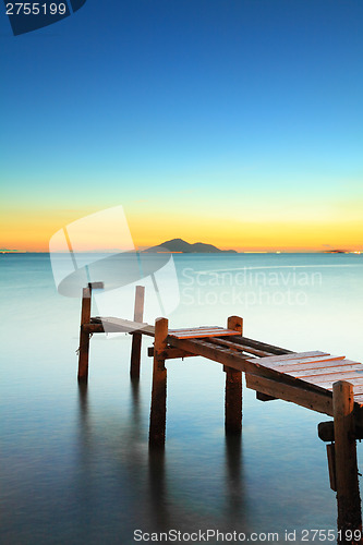 Image of Seascape with sunset and wooden bridge