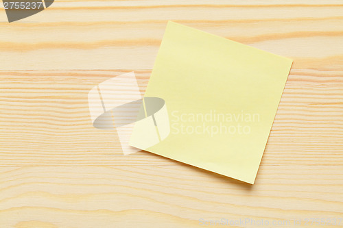 Image of Sticky memo over wooden background