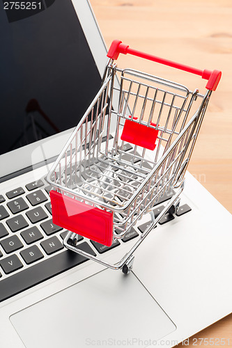 Image of Shopping trolley with laptop