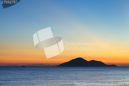 Image of Sunset seascape with small island