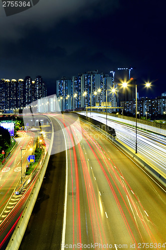Image of Cityscape with highway at night
