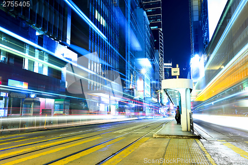 Image of Busy traffic with tram stop in Hong Kong city