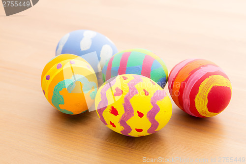 Image of Painted easter egg on wooden table