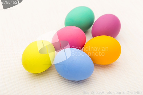 Image of Painted easter egg over white linen background