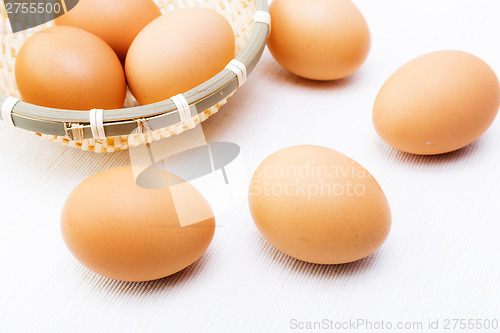 Image of Brown egg over linen background