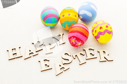 Image of Decorated easter egg with wooden text