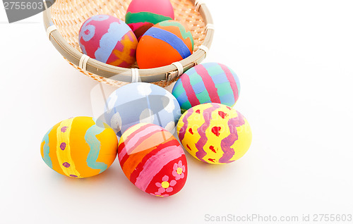 Image of Children drawing easter egg in basket