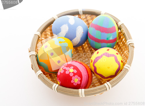 Image of Easter eggs and basket isolated 