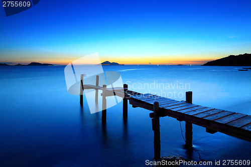 Image of Sunset seascape with wooden jetty