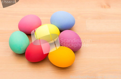 Image of Painted easter egg over wooden texture