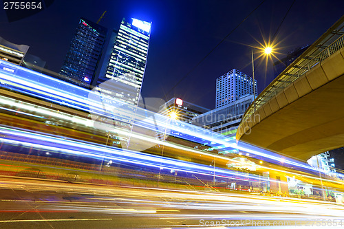 Image of Fast moving car light in city at night