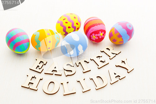 Image of Painted easter egg with wooden text 