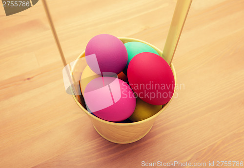 Image of Colourful easter egg in bucket