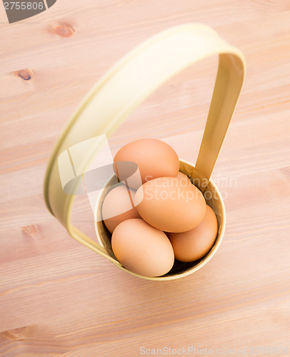 Image of Brown egg in bucket