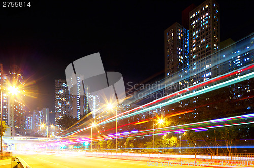 Image of Fast moving car light in city