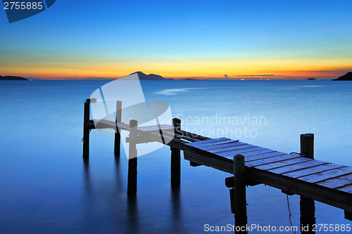 Image of Wooden bridge with seascape during sunet