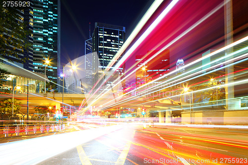 Image of Fast moving car light in city at night