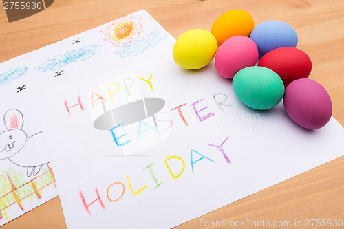 Image of Painted easter egg and little kid drawing