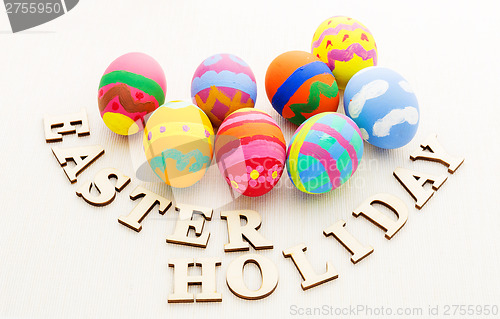 Image of Easter egg and wooden text