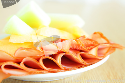 Image of Ham and melon on dish