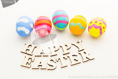 Image of Colourful design easter egg with wooden word