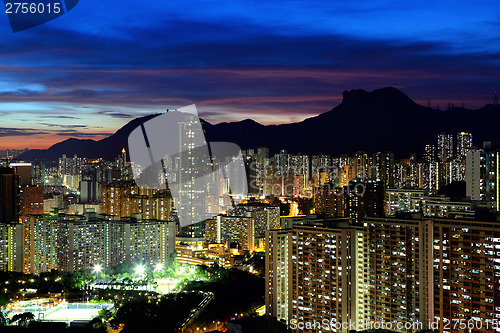 Image of Kowloon cityscape in Kong Kong with lion rock mountain