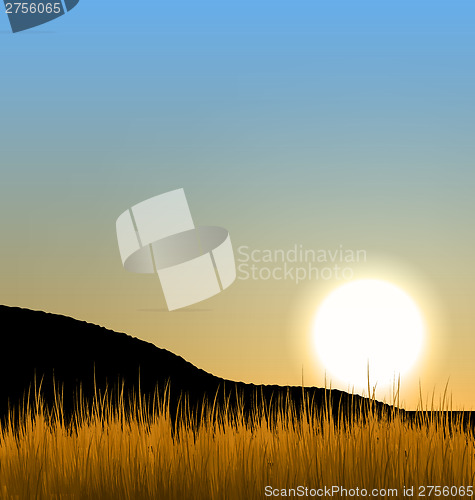 Image of Sunrise with sun, mountain and grass field