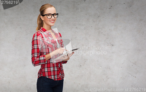 Image of smiling girl in eyeglasses with tablet pc computer