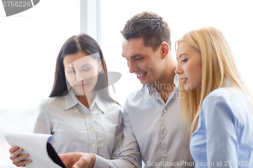 Image of business team looking at clipboard