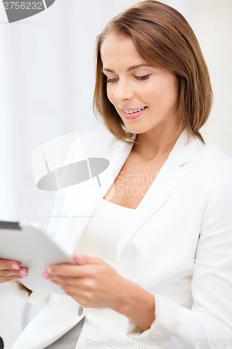 Image of businesswoman with tablet pc in office