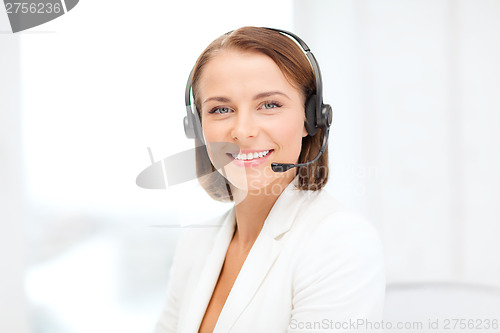 Image of smiling female helpline operator with headphones