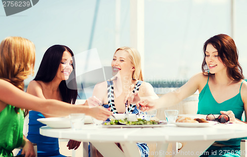 Image of girls in cafe on the beach