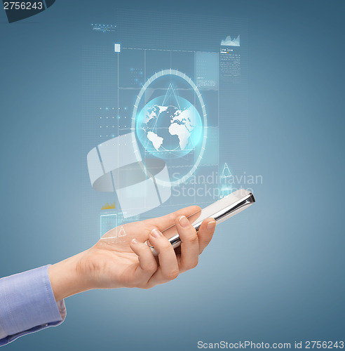 Image of close up of female hand with smartphone