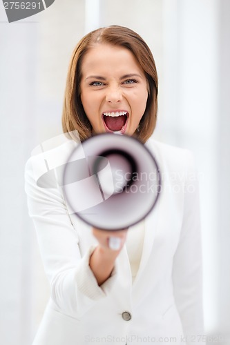 Image of strict businesswoman shouting in megaphone