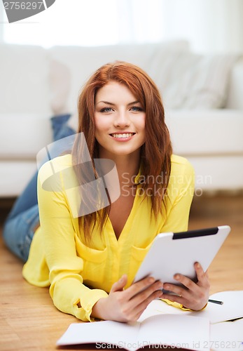 Image of student with tablet pc computer and notebooks