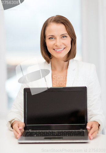 Image of smiling businesswoman with laptop computer