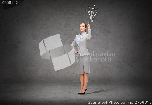 Image of smiling businesswoman with her finger up