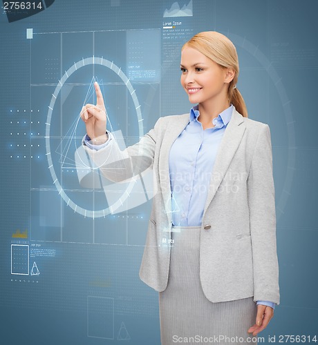 Image of smiling businesswoman working with virtual screen