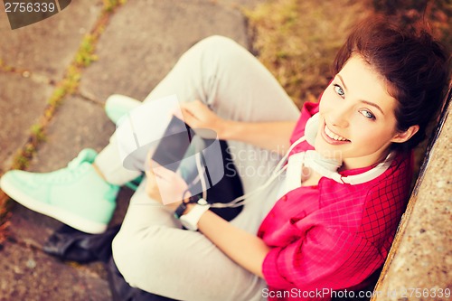 Image of girl with headphones listening to music